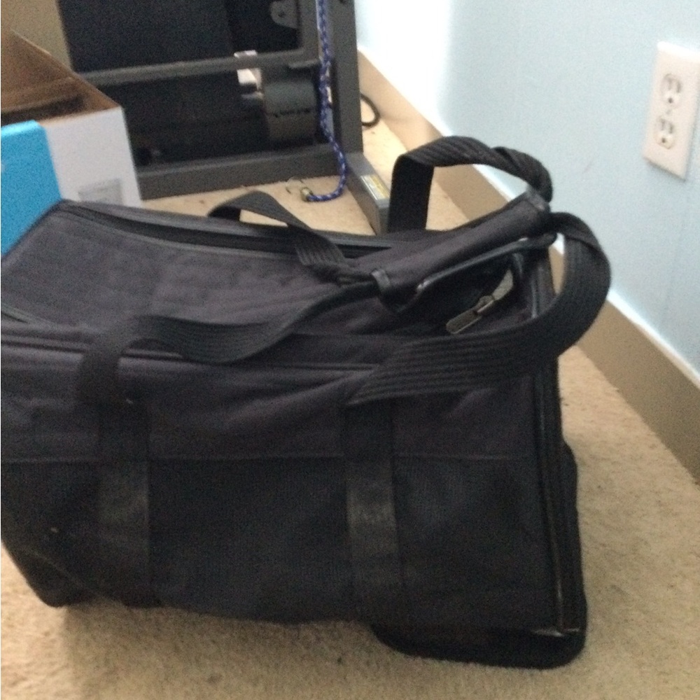 Pet Carrier-  soft sides, fits underneath seat of airplane.
